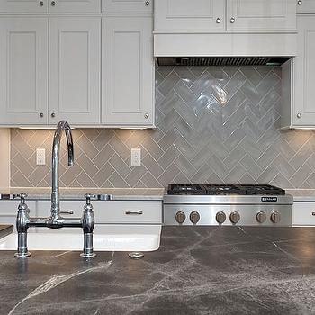 Small modern kitchen with custom copper backsplash that also adds  pattern [From: Regina Bilotta