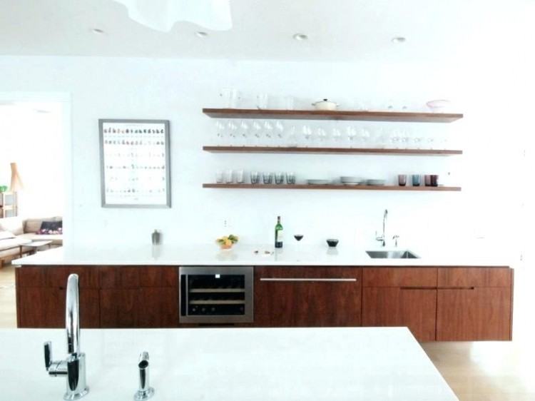 White cabinets, black countertops, and  a farmhouse sink