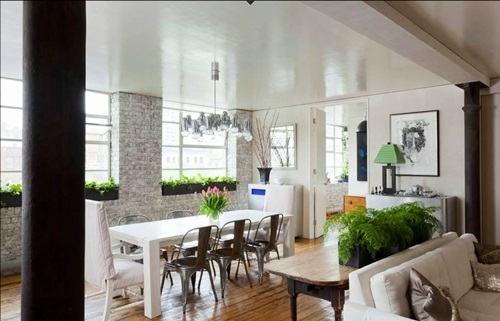 Behold the use of color in this combined kitchen, dining space and living  room