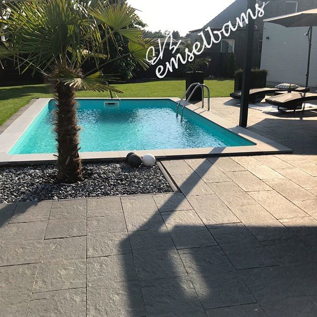 Terrace by the pool with sun loungers near the modern house