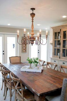 The dining table and chandelier in the kitchen of the newly renovated  Magnolia House bed and breakfast, as seen on Fixer Upper