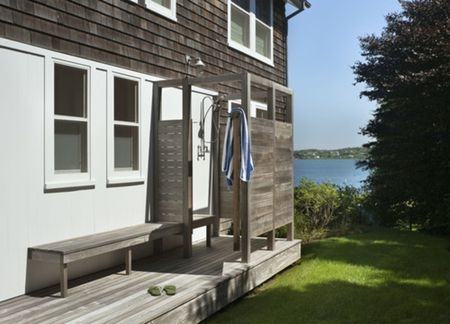 Pallets and reclaimed wood are great materials for building outdoor showers