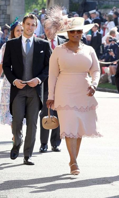 Serena Williams made an entrance with her husband to the wedding wearing a  light pink Versace draped dress and a headpiece arrangement