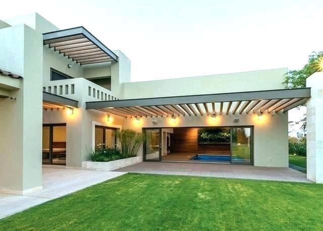 The large sloped roof on this modern mountain home provides both a sense of  openness as well as an element of privacy