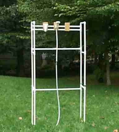 Hang camp shower bladder on the tall pole  at