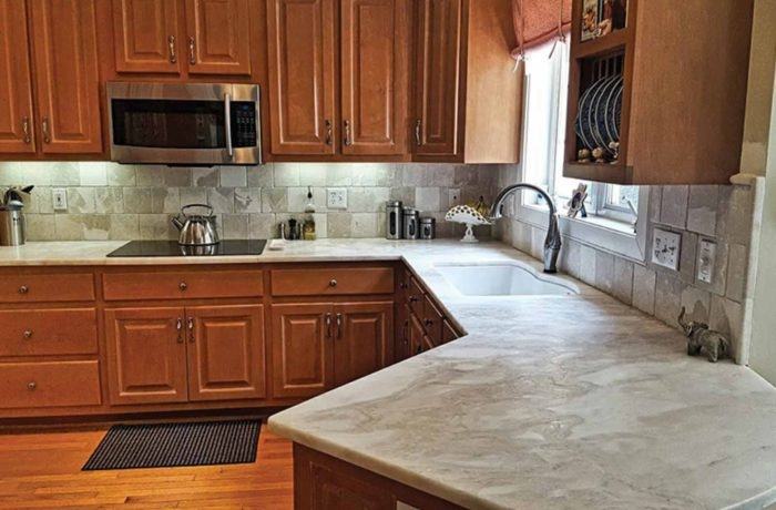 An open concept kitchen was created by removing the dining wall