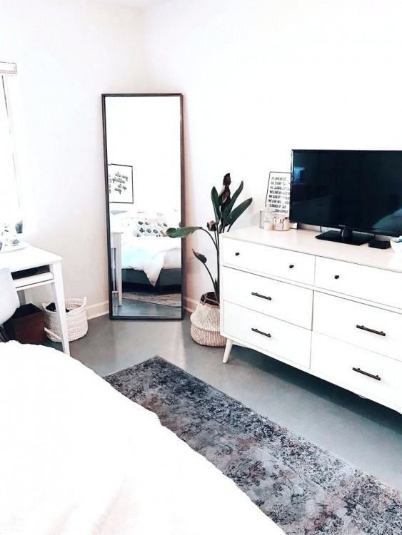 A bedroom with a beautiful oriental area rug from RugKnots