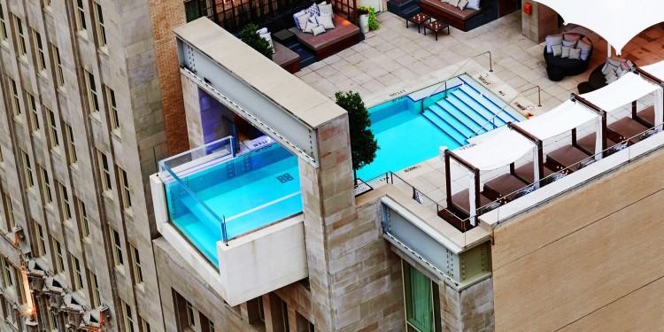 Indoor infinity pool with movie theater and bar