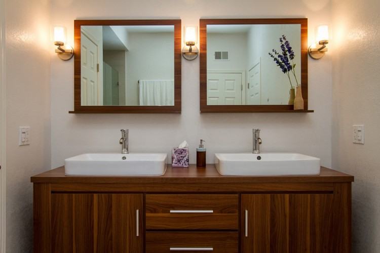 Small white bathroom with dark brown open and closed storage