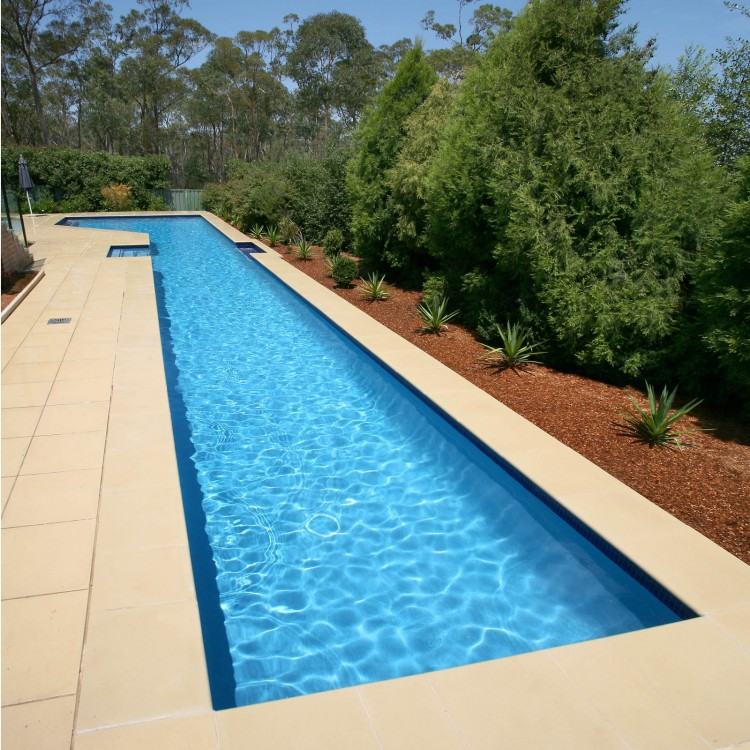 A custom made water feature with planters and wall behind  hide the