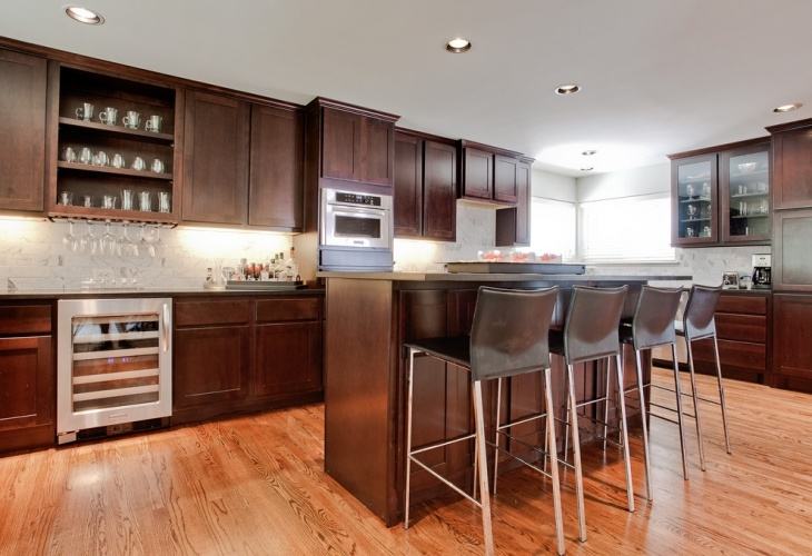 Danville kitchen cabinets in maple pearl with island in alder truffle