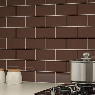 Kitchen image of white cabinets and white backsplash and stainless  appliances