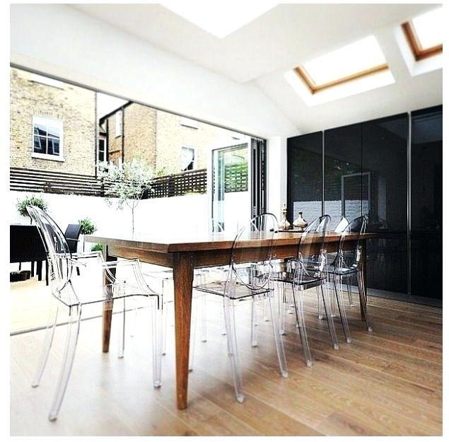 Sunburst lighting syste over the dining table View in gallery Ghost chairs