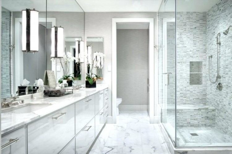 This traditional style bathroom has the feel of extra space by use of  oversized amenities