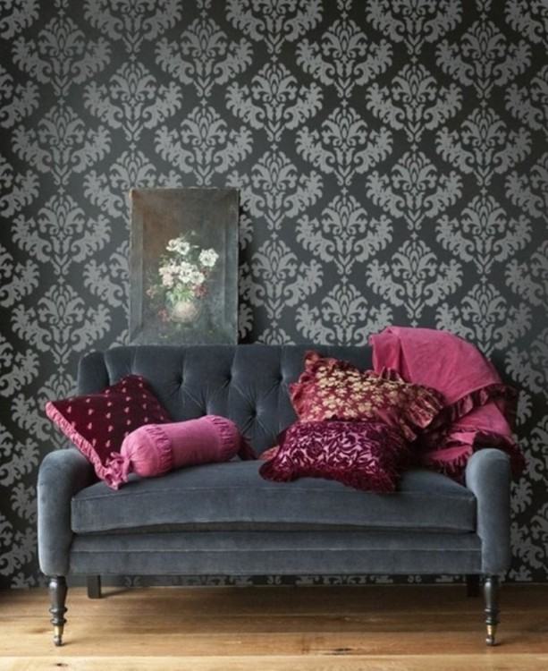 Lighting adds to the appeal of the striking black and white wallpaper  in the dining room