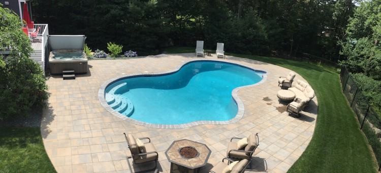 Custom outdoor zero infinity edge swimming pool designs with waterfalls  and fiber optic lighting NJ