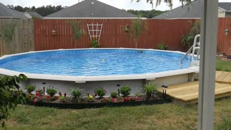 This above ground pool is unique as it is bricked into this villa style  home