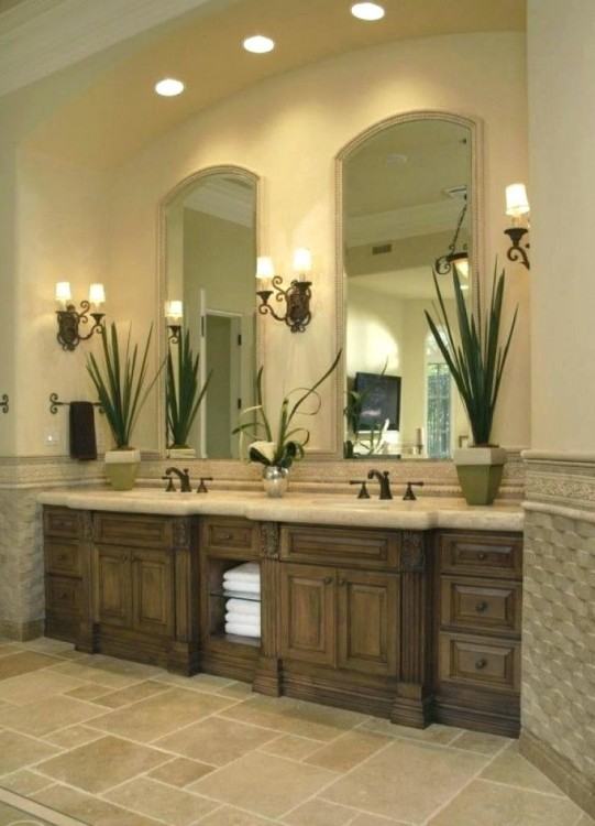 Painted and glazed master bath vanity with double sinks and recessed linen  cabinet