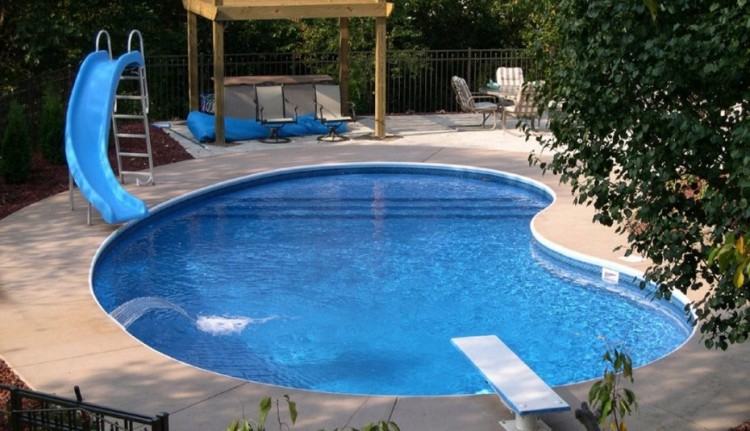 On the positive side of a yard sloping away you have a few more options of  thing you can do to make for a more dramatic pool